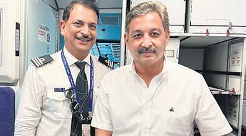 MP Rajiv Pratap Rudy (L) with Rajya Sabha member Sambhaji Chhatrapati on board the aircraft on Sunday.