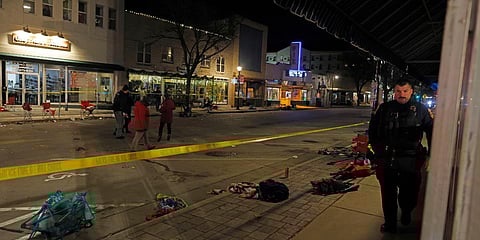 Police canvass the streets in downtown Waukesha, Wisconsin after a vehicle plowed into a Christmas parade hitting more than 20 people. (Photo| AP)