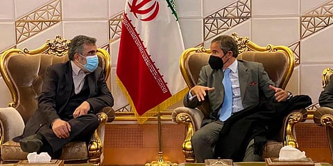 Director General of IAEA, Rafael Mariano Grossi (R) speaks with deputy head of the Atomic Energy Organization of Iran Behrouz Kamalvandi upon his arrival in Iran. (Photo | AP)