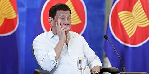Philippine President Rodrigo Duterte listens during a virtual plenary session of the ASEAN-China Special Summit in Davao City. (Photo | AP)