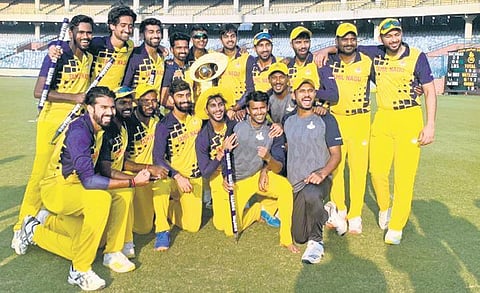 Tamil Nadu players celebrate with the Syed Mushtaq Ali Trophy in New Delhi.