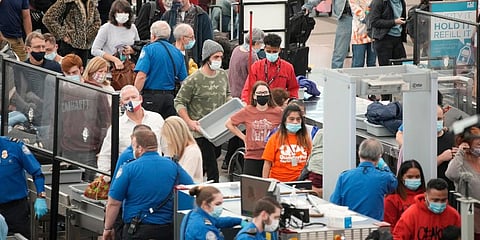 Travelers queue up at the south security checkpoint as traffic increases with the approach of the Thanksgiving Day holiday at Denver International Airport in Denver. (Photo | AP)