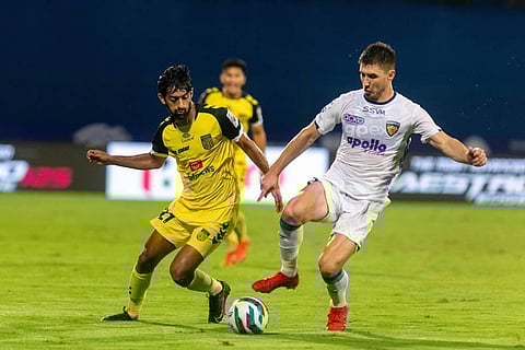 Nikhil Chandrashekhar Poojary of Hyderabad FC and Mirlan Mursaev of Chennaiyin FC vie for the ball during match 5 of season 8 of Indian Super League. (Photo | PTI)