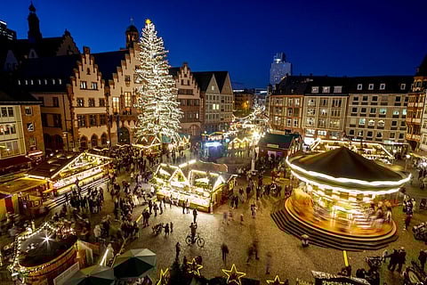 Despite the pandemic inconveniences, stall owners selling ornaments, roasted chestnuts and other holiday-themed items in Frankfurt (Photo | AP)