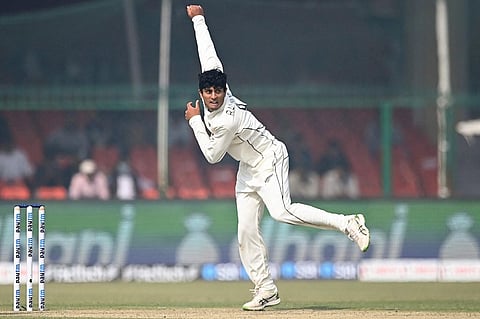 Rachin Ravindra bowls on Day 1 of the first Test at Kanpur (Photo | AFP)