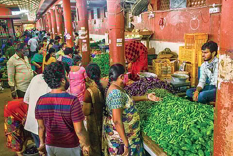 People buy tomatoes in Rythu Bazaar in Visakhapatnam on Wednesday I G Satyanarayana