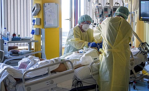 Intensive care nurses treat a patient severely ill with Covid-19 in the Corona intensive care unit at the University Hospital in Halle/Saale (Photo | AP)