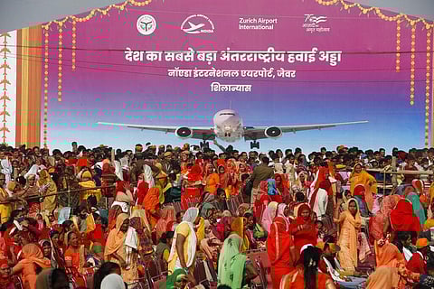 A crowd gathers for the foundation stone laying ceremony of Noida International Airport in Jewar. (Photo | AP)