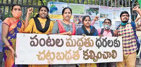 Protestors display a placard made using grains during a maha dharna organised by farmers and activists of AIKSCC State unit in Hyderabad, on Thursday, Nov 25, 2021. (Photo | RVK Rao)