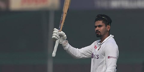 India's Shreyas Iyer raises his bat after scoring a century during the day two of their first test cricket match with New Zealand in Kanpur, India, Friday, Nov. 26, 2021. (Photo | AP)