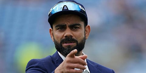 India's captain Virat Kohli gestures as he walks back after the toss on the first day of third Test cricket match between England and India, at Headingley cricket ground in Leeds. (File Photo | AP)