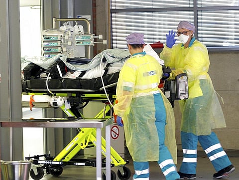 Crew of a Dutch ambulance brings a COVID-19 19 patient from Rotterdam to BG University Hospital Bochum (Photo | AP)