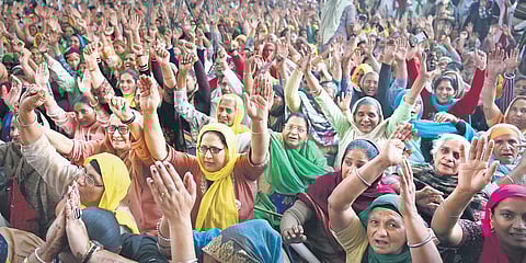Women shout slogans during the anniversary of protests against the farm laws at Singhu border. (Photo | Parveen Negi, EPS)