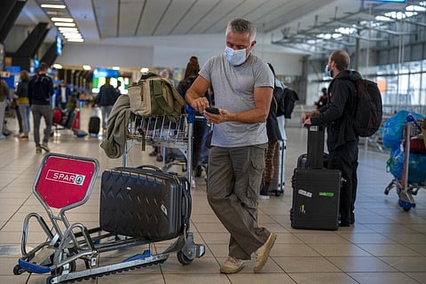 People lineup to get on the Air France flight to Paris at OR Tambo's airport in Johannesburg, South Africa', Friday Nov. 26, 2021. (Photo | AP)