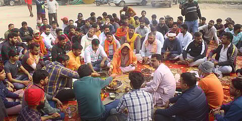 Members of a right-wing outfit offering havan at at Sector 37 in Gurugram. (Photo| PTI)