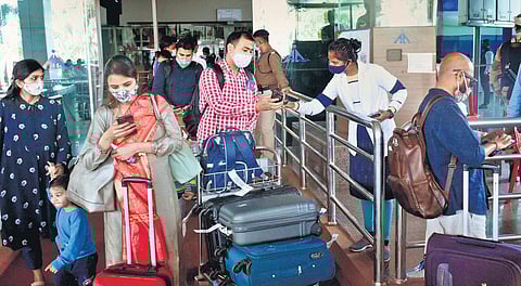 Passengers arriving in Ranchi show Covid-19 double vaccination certificates to airport officials on Saturday (Photo | PTI)
