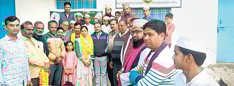 Naziya Parvin and her father Issamuddin (both garlanded) felicitated by residents of the Anjuman locality in Pachpahar, Jhalawar district, after her outstanding NEET results