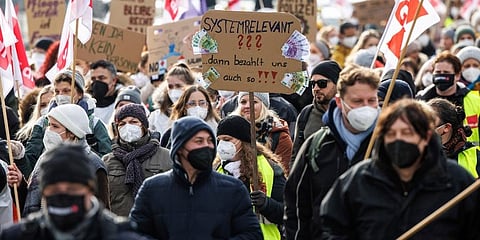 Employees of public services attend a rally for better payment in Munich, Germany. (Photo | AP)
