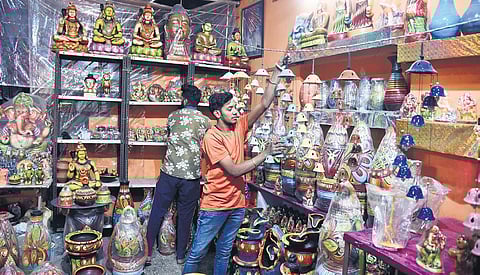 Parveen from Kumhar Gram sellling clay-made decorative items. (Photo| EPS)