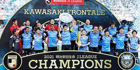 Kawasaki Frontale players celebrate with the trophy after winning J-League title. (Photo | AP)
