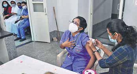 A health worker receives a dose of Covid-19 vaccine in Bengaluru | Shriram BN