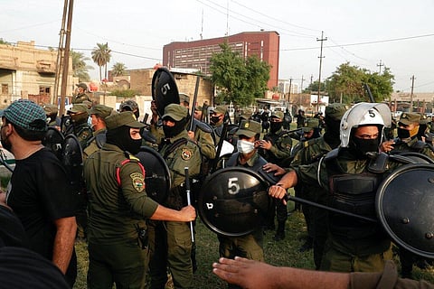 Security forces prevent protesters denouncing election results from storming the heavily fortified Green Zone during a protest in Baghdad, Iraq. (Photo | AP)