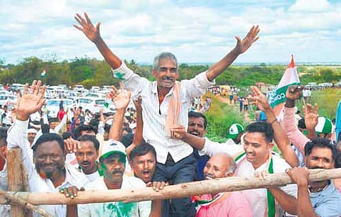 Jubilant Congress workers after party candidate Srinivas Mane (inset) bagged the Hanagal seat in Haveri on Tuesday | Hemanth D