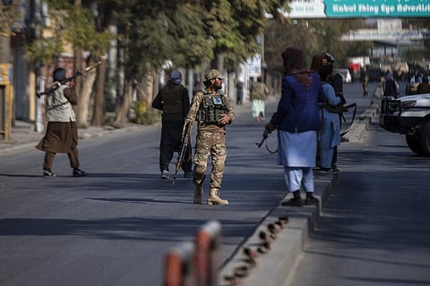 Taliban fighters block roads after an explosion. (File Photo | AP)