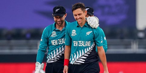 New Zealand's Trent Boult (R) and Devon Conway during the Twenty20 World Cup match against Scotland in Dubai. (Photo | AP)