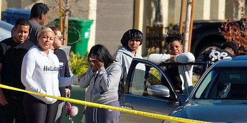 Neighbors react near a home where five bodies were found in the city of Lancaster in the high desert Antelope Valley north of Los Angeles. (Photo | AP)