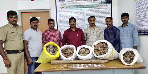 Davangere DCRB police team with the seized pangolin scales. (Photo| EPS)