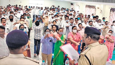 DIG LKV Ranga Rao administering a pledge against cultivation of ganja in the Agency villages to sarpanches of Narsipatnam division. (Photo| EPS)