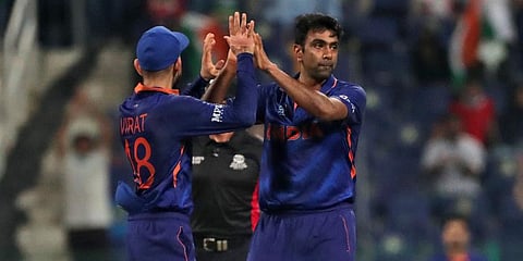 India's Ravichandran Ashwin, right, celebrates the dismissal of Afghanistan's Najibullah Zadran with captain Virat Kohli during their ICC T20 World Cup match in Abu Dhabi, Nov 3, 2021. (Photo | AP)