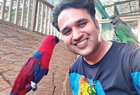 Sourav Nayyar with an Eclectus parrot. (Photo| EPS)