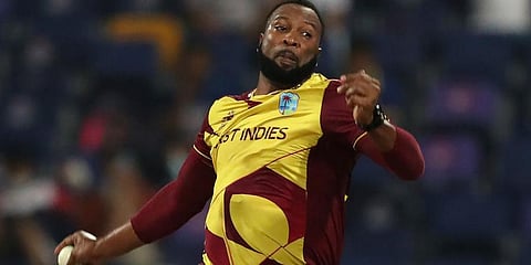 West Indies captain Kieron Pollard bowls during the Twenty20 World Cup match between Sri Lanka and West Indies in Abu Dhabi. (Photo | AP)