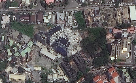 This satellite image provided by Maxar Technologies shows the close up of a collapsed building, center, in Lagos, Nigeria on Wednesday. (Photo I AP)