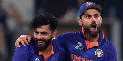 India's Ravindra Jadeja celebrates with captain Virat Kohli the dismissal of Scotland's Matthew Cross. (Photo | AP)