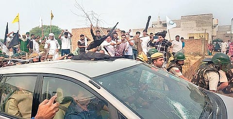 Farmers target the car of BJP MP Ram Chander Jangra in Hisar on Friday. (Photo | PTI)