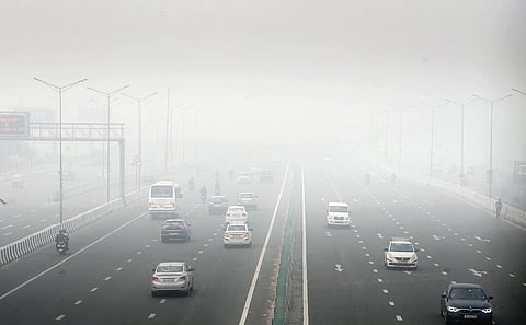 A thick blanket of smog on National Highway 9 in Delhi a day after Diwali, hampers visibility on Friday morning. (Photo | Parveen Negi/EPS)