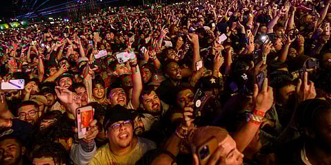 The crowd watches as Travis Scott performs at Astroworld Festival at NRG park on Friday, Nov. 5, 2021 in Houston. (Photo | AP)