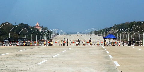 Soldiers stand to provide security near a road in Naypyitaw, Myanmar. (Photo | AP)