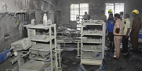 People inspect a hospital's COVID-19 ward that caught fire in Ahmednagar. (Photo | AP)