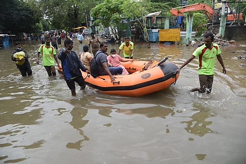 People rescued using boats after the heavy rains at teynampet, in Chennai on Sunday. (Photo | R Satish Babu, EPS)