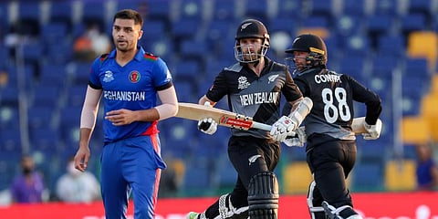 New Zealand captain Kane Williamson and teammate Devon Conway (R) run between the wickets during the Twenty20 World Cup match against Afghanistan in Abu Dhabi, UAE. (Photo | AP)