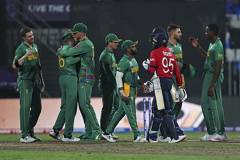 South African players celebrate after their win in the Cricket Twenty20 World Cup match against England. (Photo | AP)