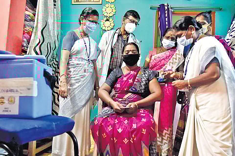 GCC health staff vaccinating a woman against Covid-19 during the door-to-door campaign in Chennai on Saturday | P Jawahar