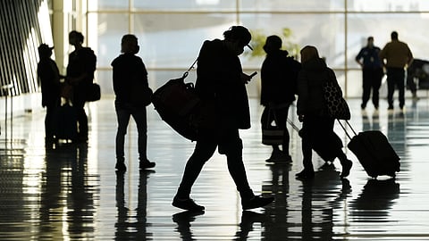 Passengers walk through Salt Lake City International Airport in Salt Lake City, Oct. 27, 2020. From Nov 8, 2021, bans on travel from specific countries are over. (File photo | AP)
