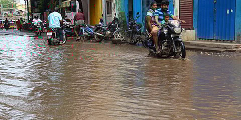 Following the heavy rainfall on Saturday night, water is clogged at the roads at Pechiamman Padithurai road in Madurai. (Photo| KK Sundar, EPS)