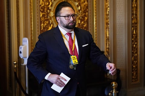 Jason Miller, senior adviser to the Trump 2020 re-election campaign, walks in the Capitol during the second impeachment trial of former President Donald Trump in the Senate. (File photo | AP)