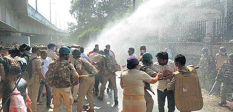 Police trying to stop agitating BJYM workers from entering the DIG office. (Photo | Express)